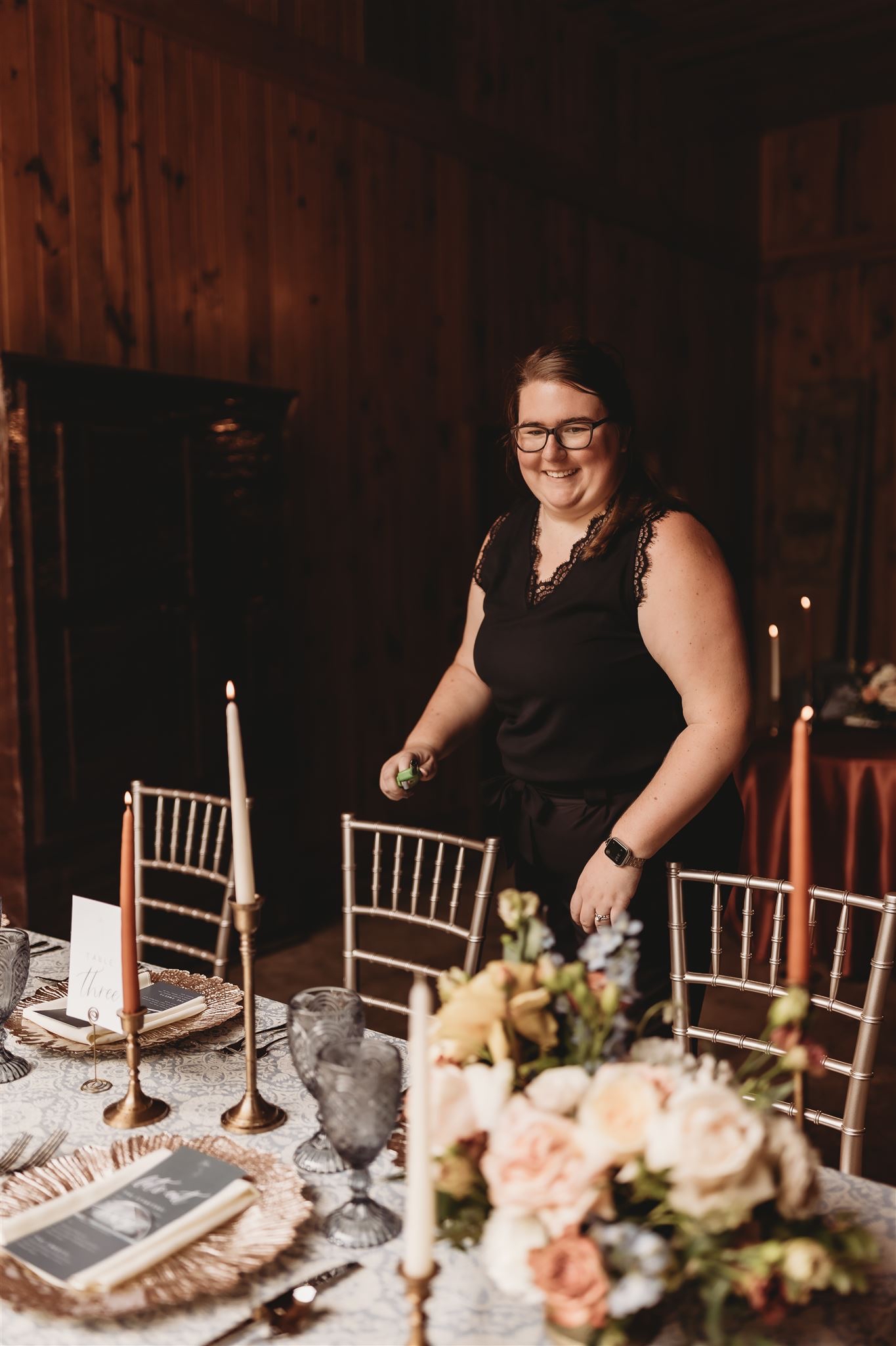 Hannah standing next to a decorated table