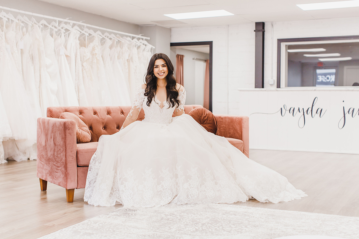 model sitting on a couch at Vayda Jane Bridal Boutique