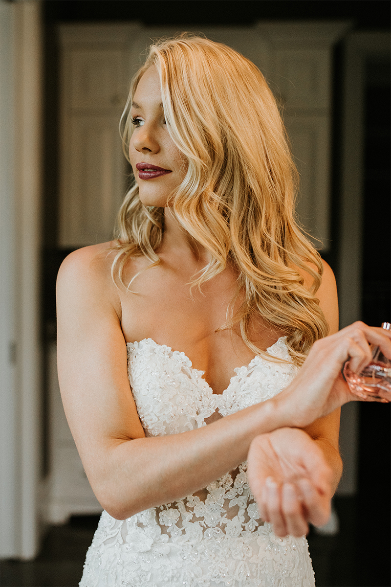 a smiling model in a wedding dress