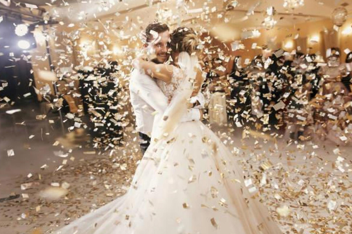 wedding couple hugging in the middle of the dance floor