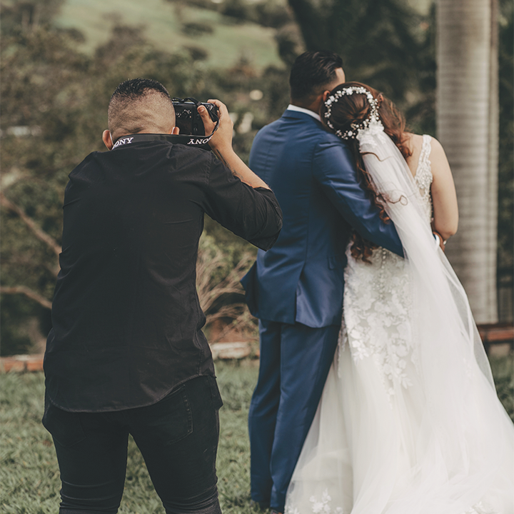 photographer taking photos of a wedding couple