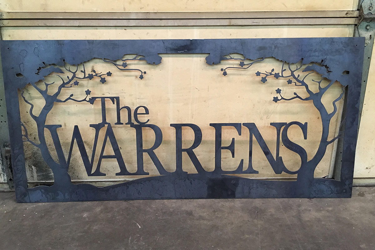 metal work featuring the last name of Warrens