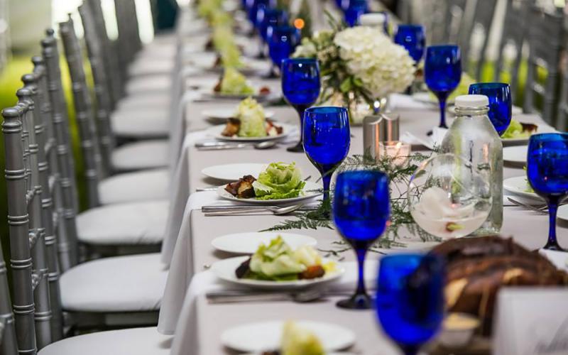 a table decorated for a wedding reception at Firefly Grill