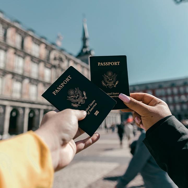 hands holding passports