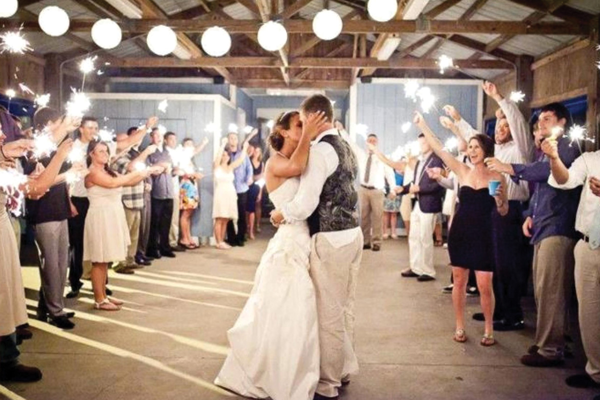 wedding couple kissing in the middle of the dance floor